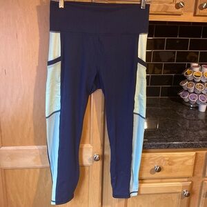 Women’s Fabletics Powerhold high waisted capri leggings. Size large, navy blue